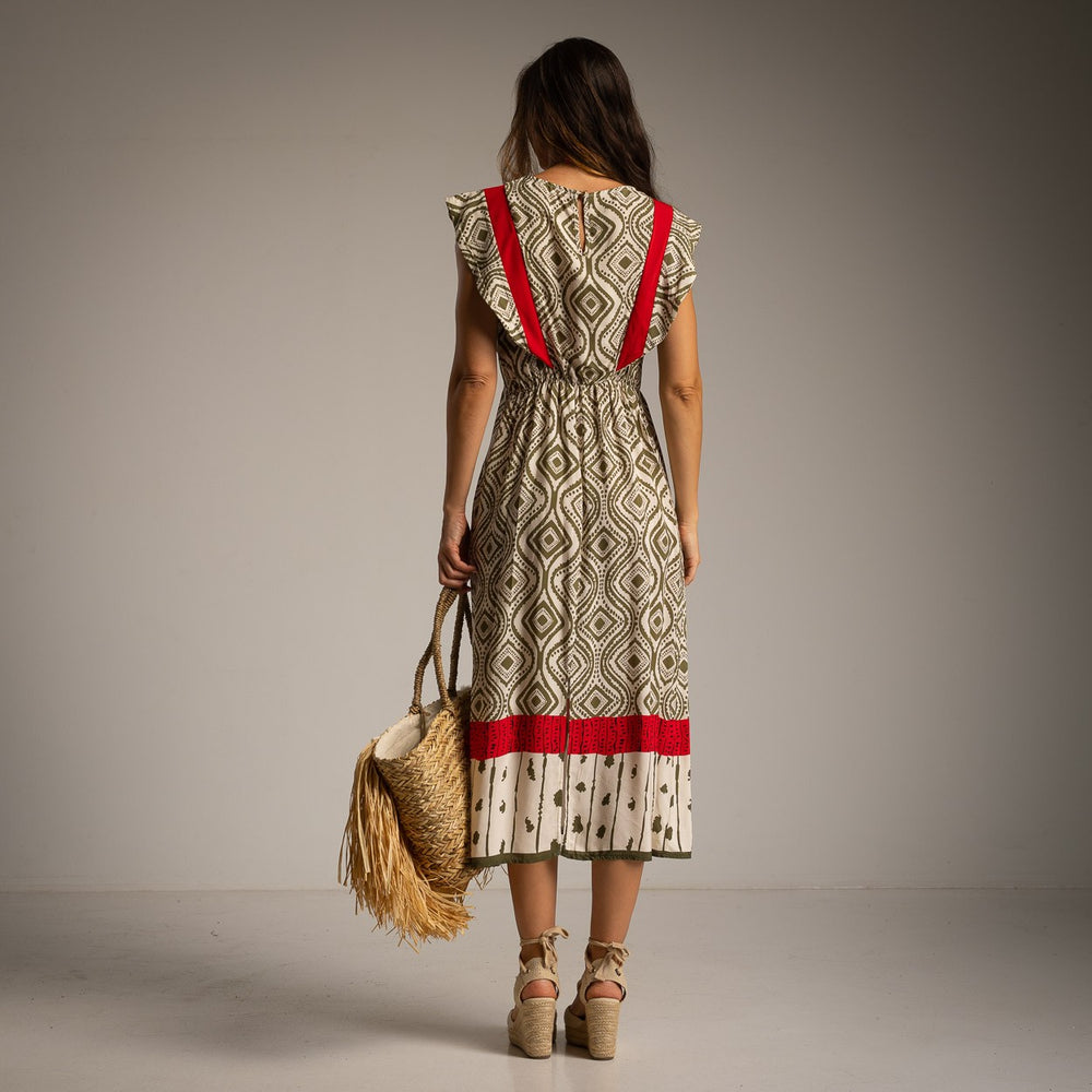 Back view of geometric print midi dress with scarlet red contrast details