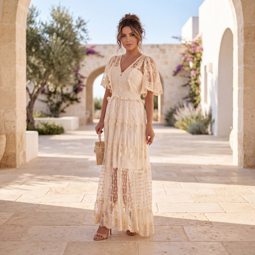 Woman wearing Lace Romance Maxi Dress in Soft Vanilla Cream with elegant lace details and maxi silhouette