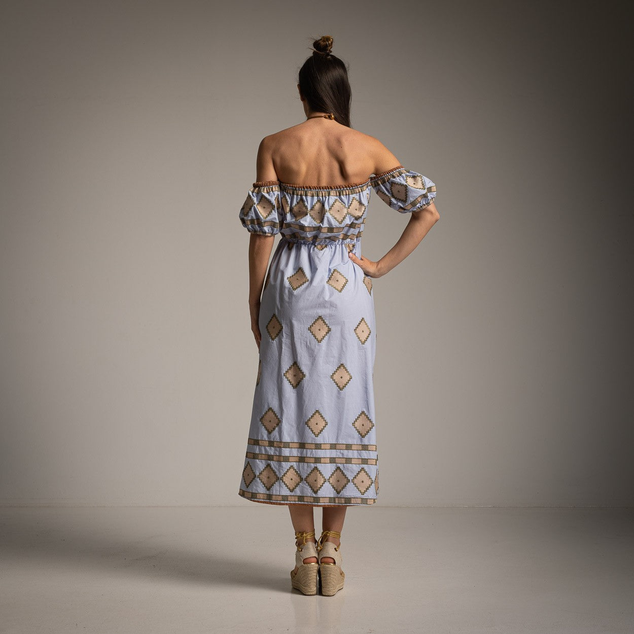 Back view of MARIΓIOÚ off-shoulder midi dress in Aegean Blue with relaxed summer silhouette