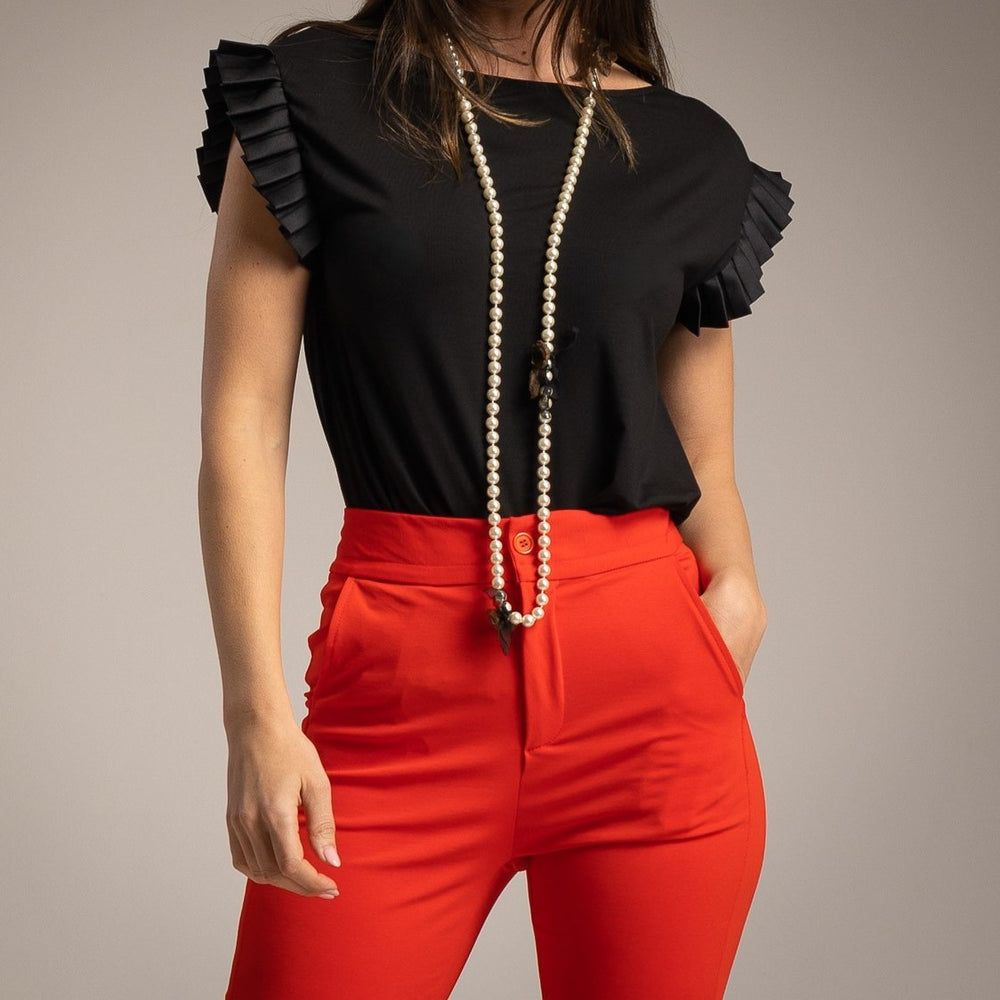 Front detail of the Amalfi Ruffle Sleeve Top in Classic Black featuring elegant layered ruffle sleeves.