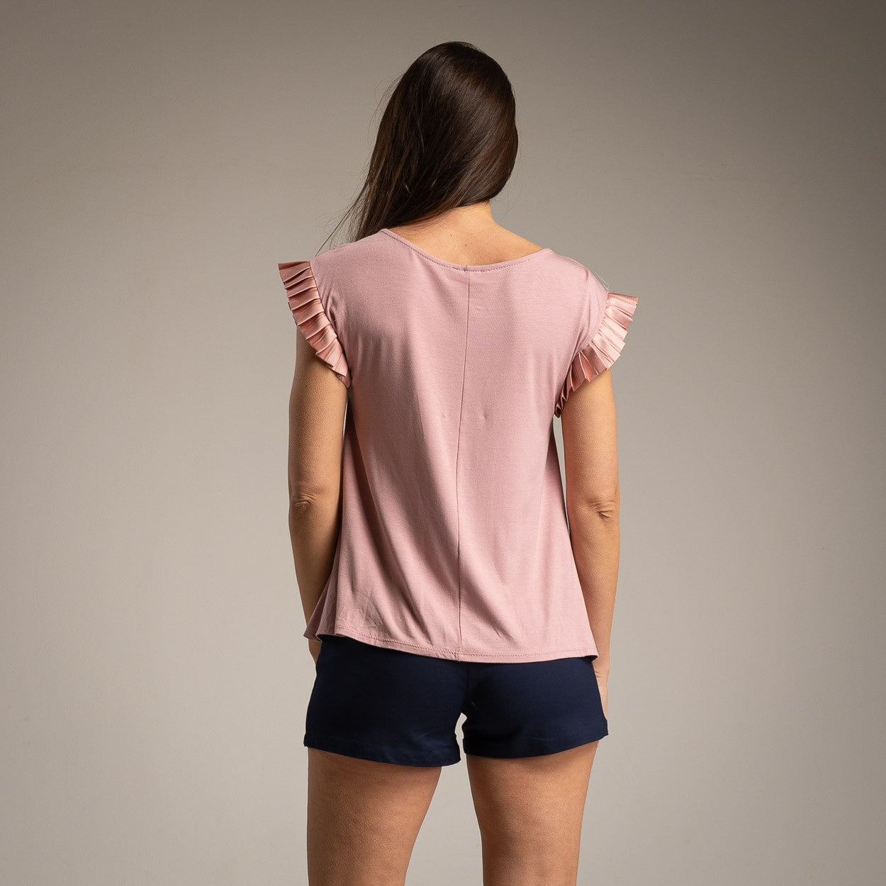 Back view of the Amalfi Ruffle Sleeve Top in Soft Blush Rose showing the relaxed fit.