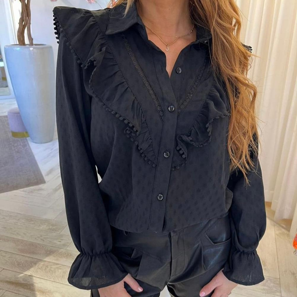 Black ruffle blouse with pompom trim, lace inserts and flounced cuffs - front view
