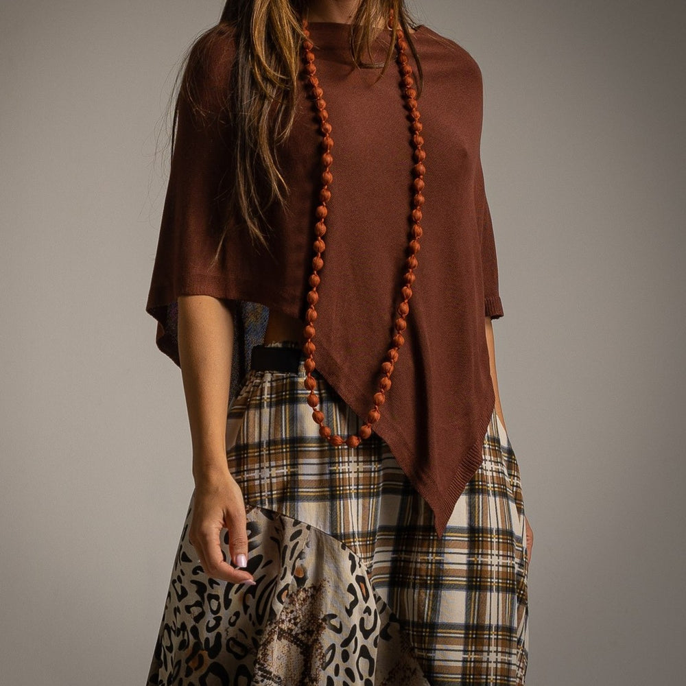 Brown asymmetric knit poncho with draped point hem - front view
