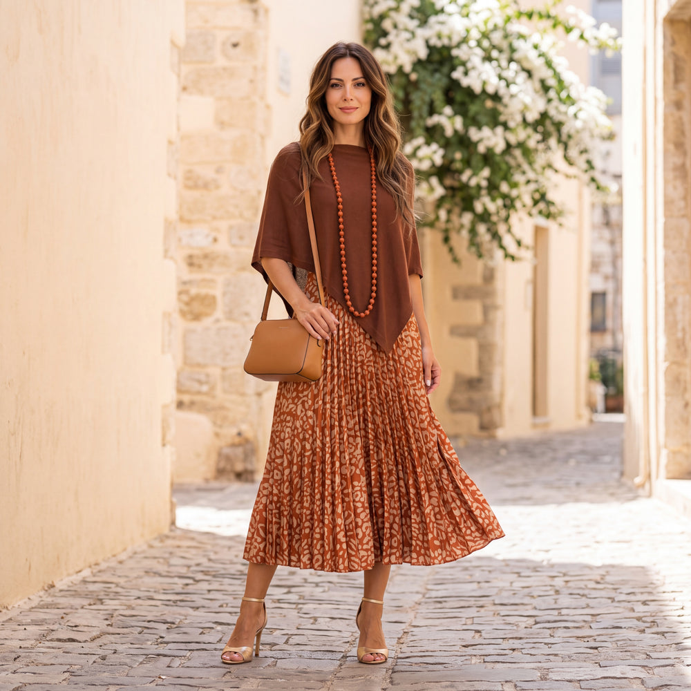 Brown asymmetric knit poncho with draped point hem by MARIΓIOU
