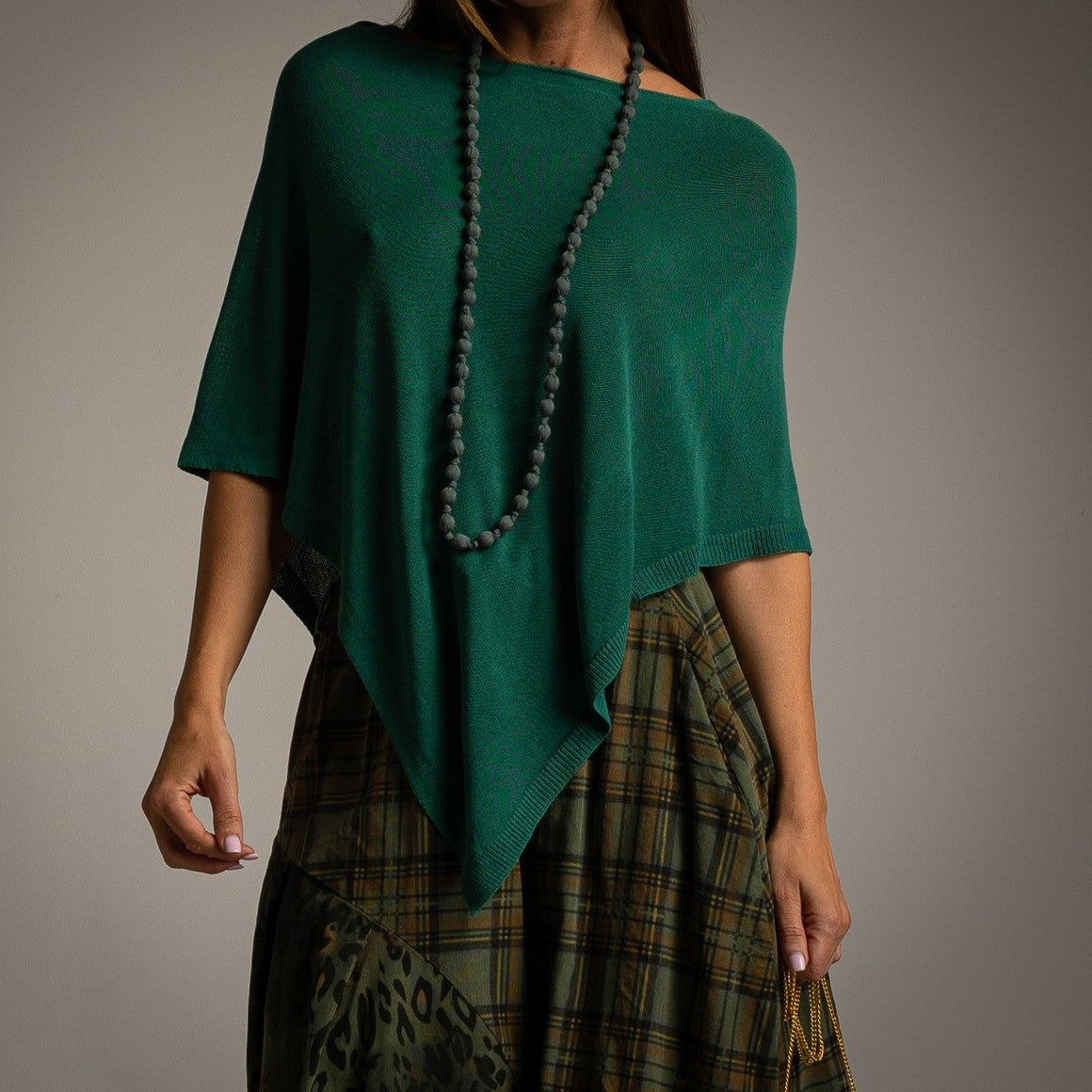 Emerald asymmetric knit poncho with draped point hem - front view