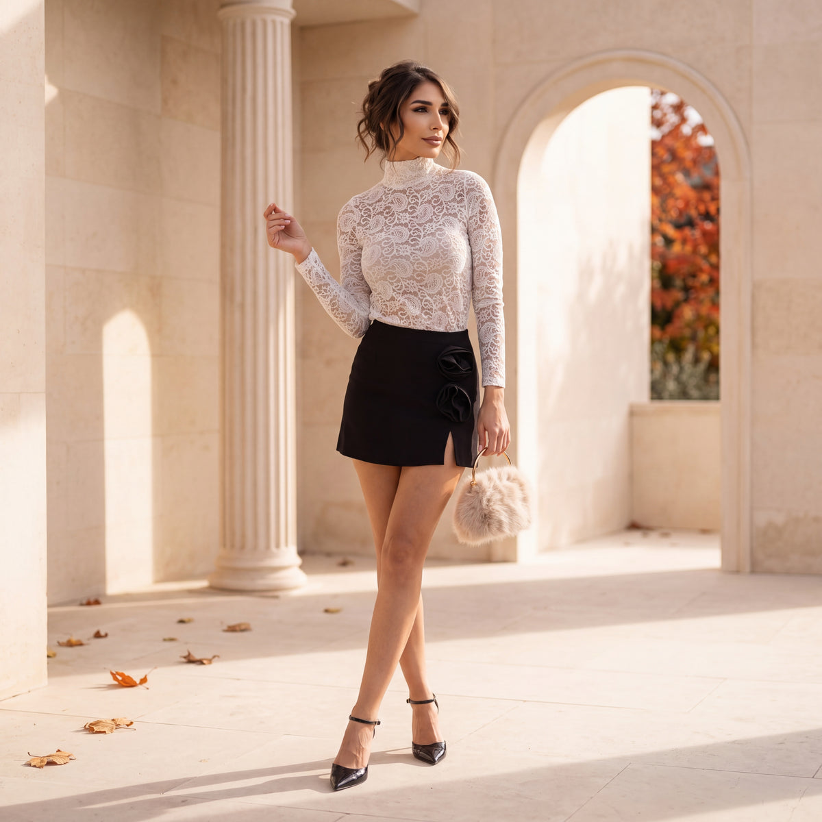 Black mini skort with sculpted fabric roses at the hip by MARIΓIOU