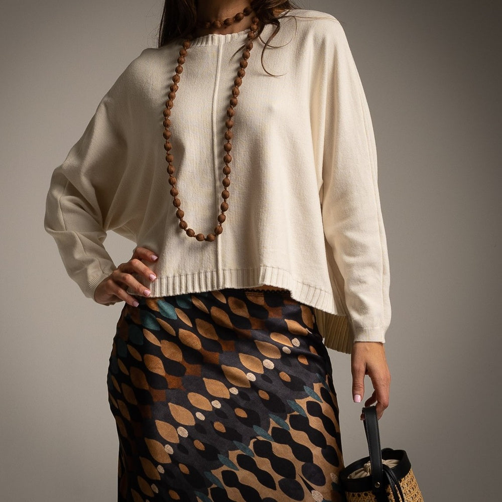Ivory White oversized knit sweater with centre seam, dropped shoulders and ribbed hem - front view