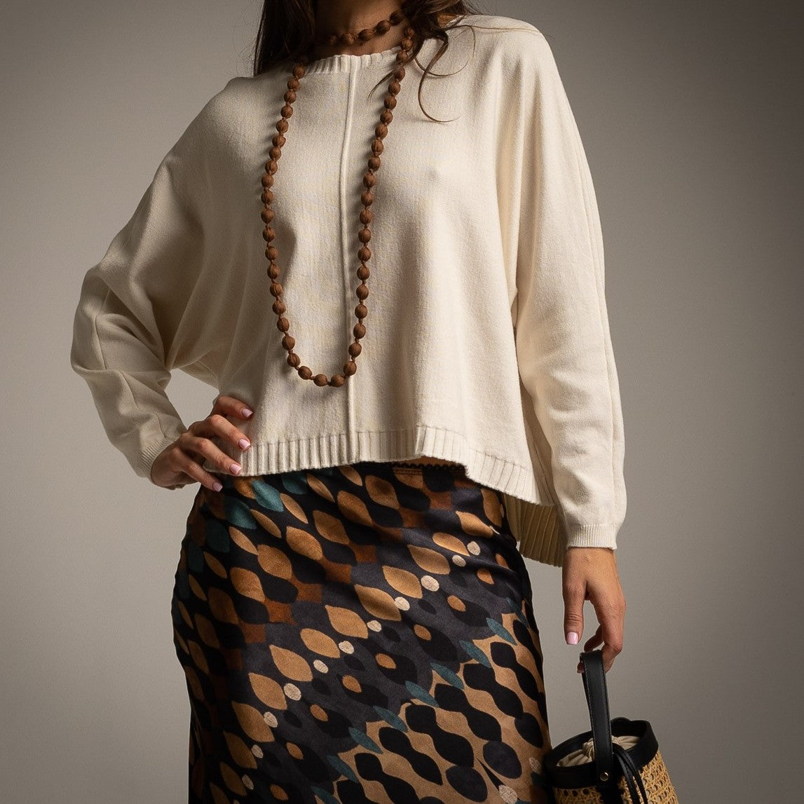 Ivory White oversized knit sweater with centre seam, dropped shoulders and ribbed hem - front view