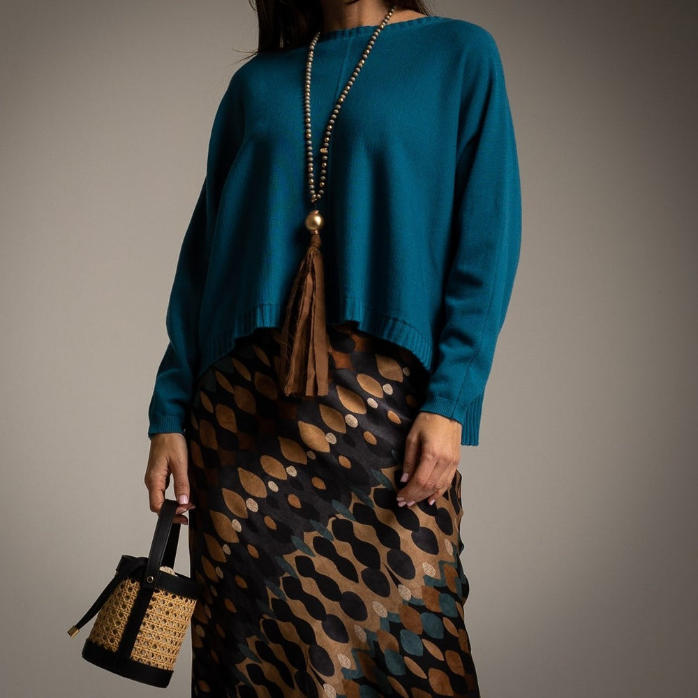 Petrol Blue oversized knit sweater with centre seam, dropped shoulders and ribbed hem - front view