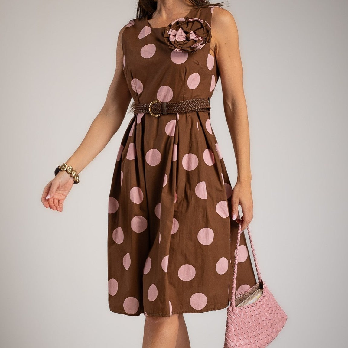Close-up of chocolate rose cotton midi dress with oversized pink polka dots