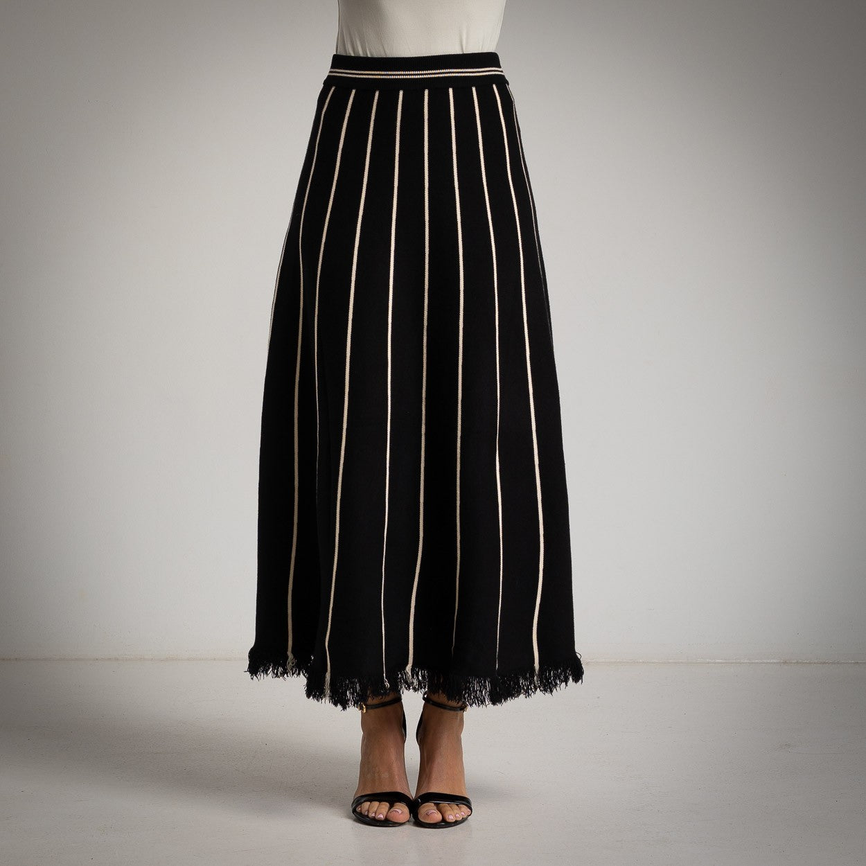 MARIΓIOÚ black striped knit maxi skirt – front studio view