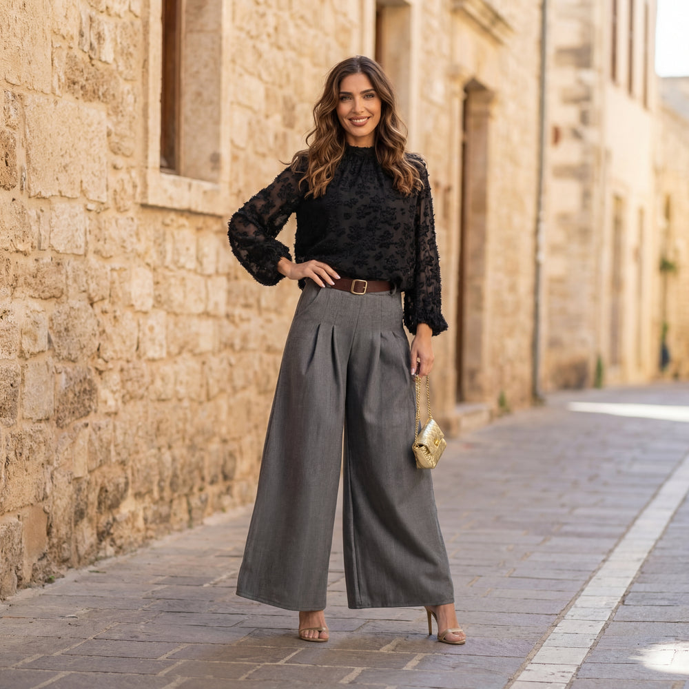 Black textured blouse styled with wide-leg trousers – outdoor look