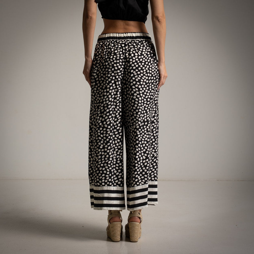 MARIΓIOÚ black and white abstract dot wide leg pants back view with flowy silhouette and comfortable fit