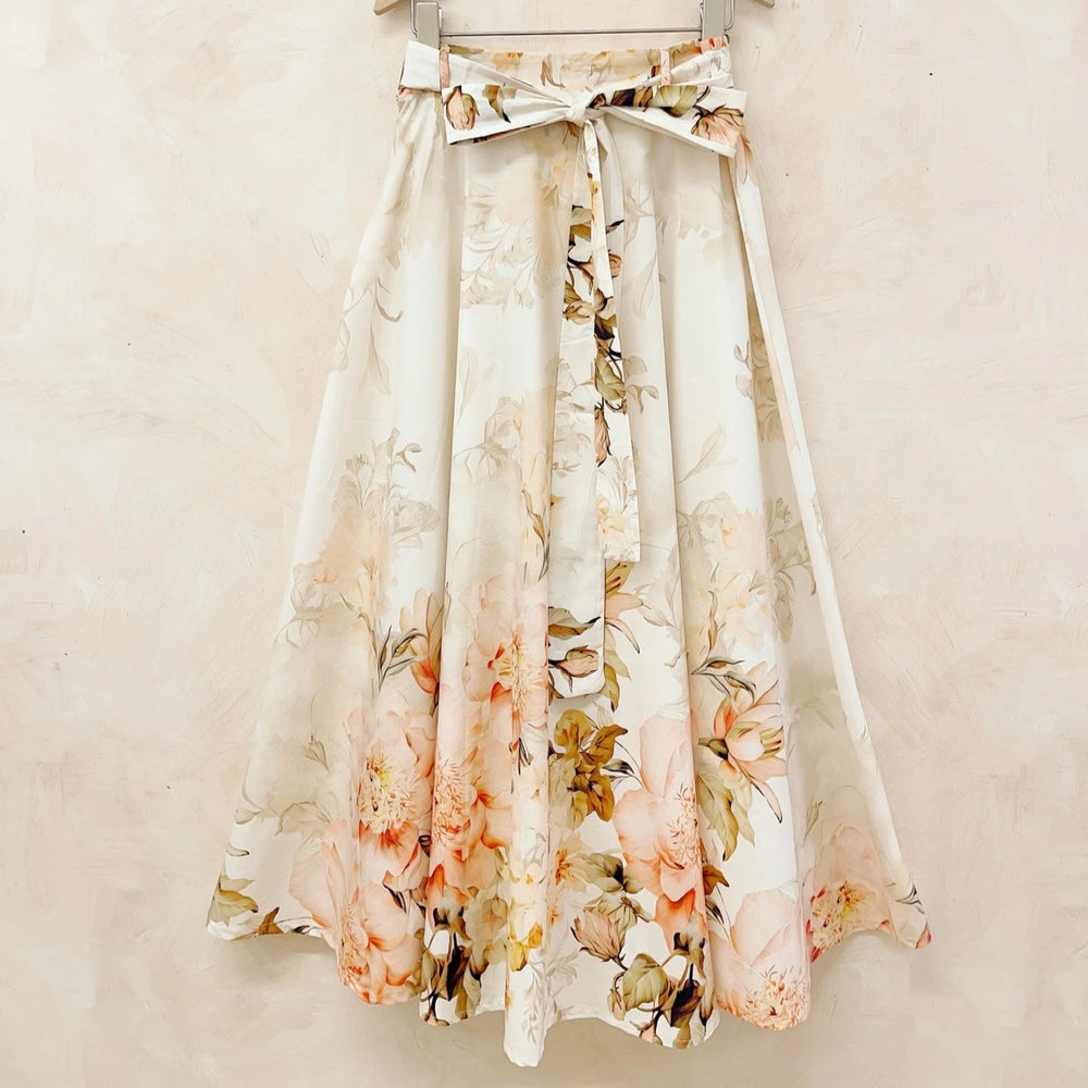 Floral midi skirt with watercolor print, A-line silhouette and self-tie waist belt.
