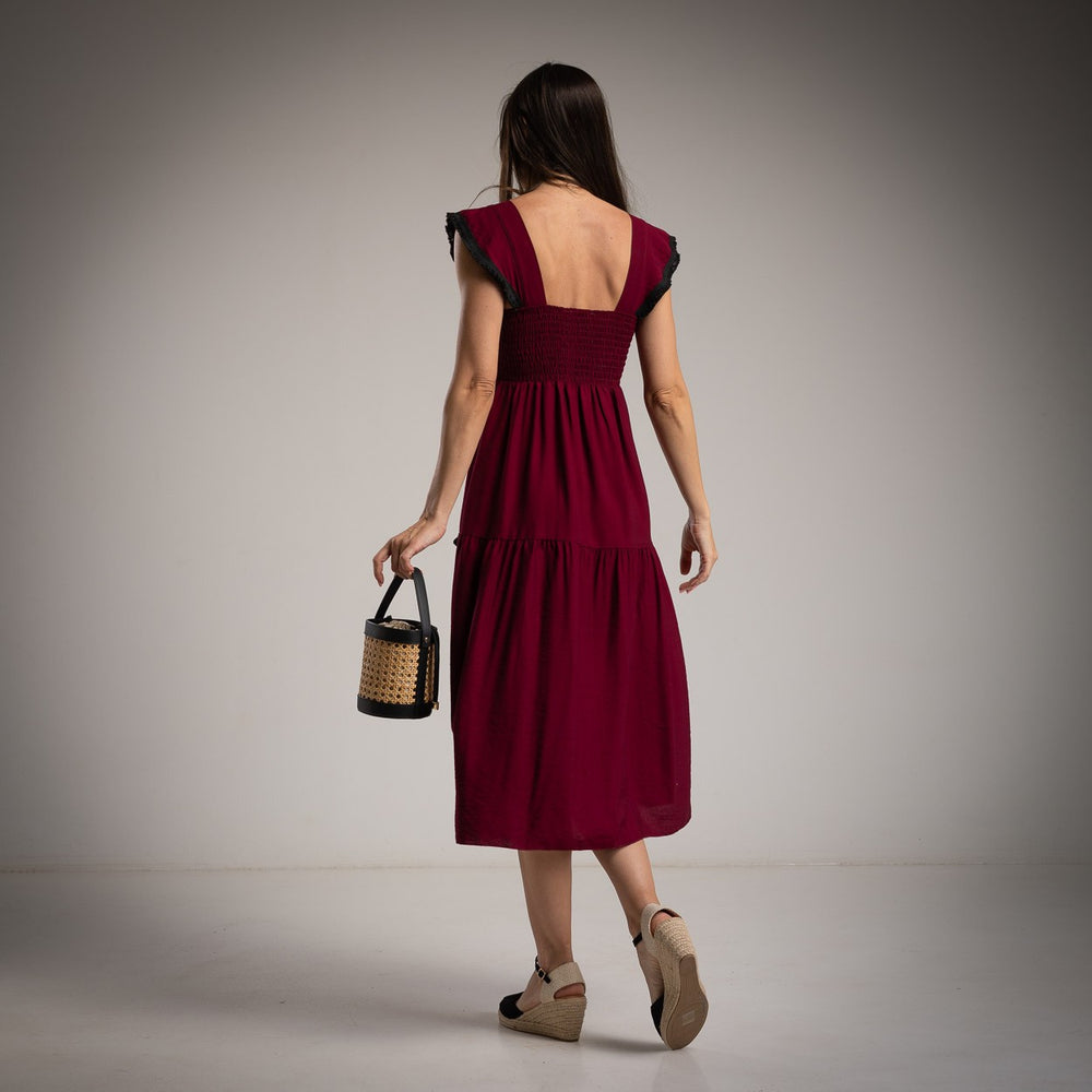 marigiou burgundy midi dress with black trim back view