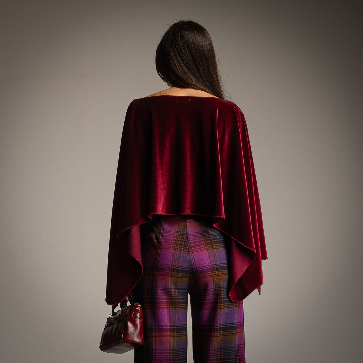 Velvet Cherry cropped velvet cape in deep wine red with wide draped sleeves - back view