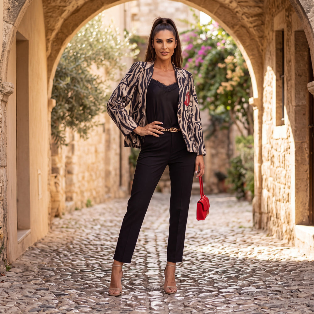 Black tailored cropped trousers with pressed crease and slim tapered leg by MARIΓIOU