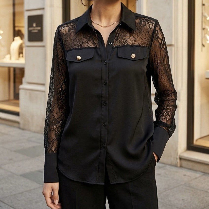 Black satin blouse with sheer lace yoke, flap pockets and jewelled buttons - front view