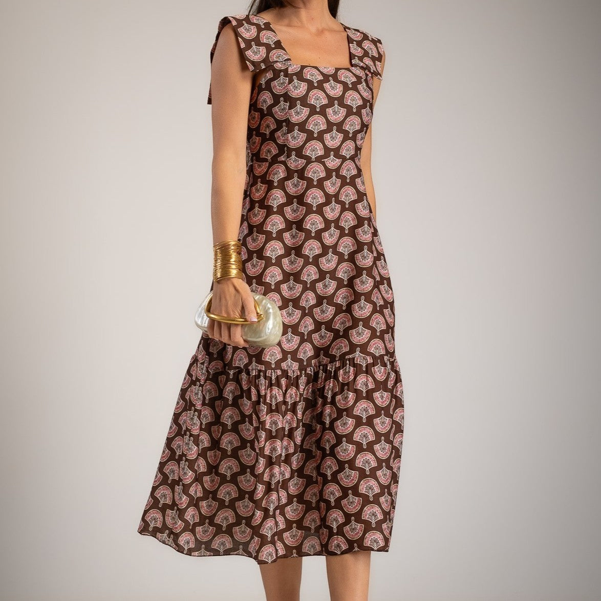 Chocolate fan print midi dress with statement shoulders and feminine square neckline