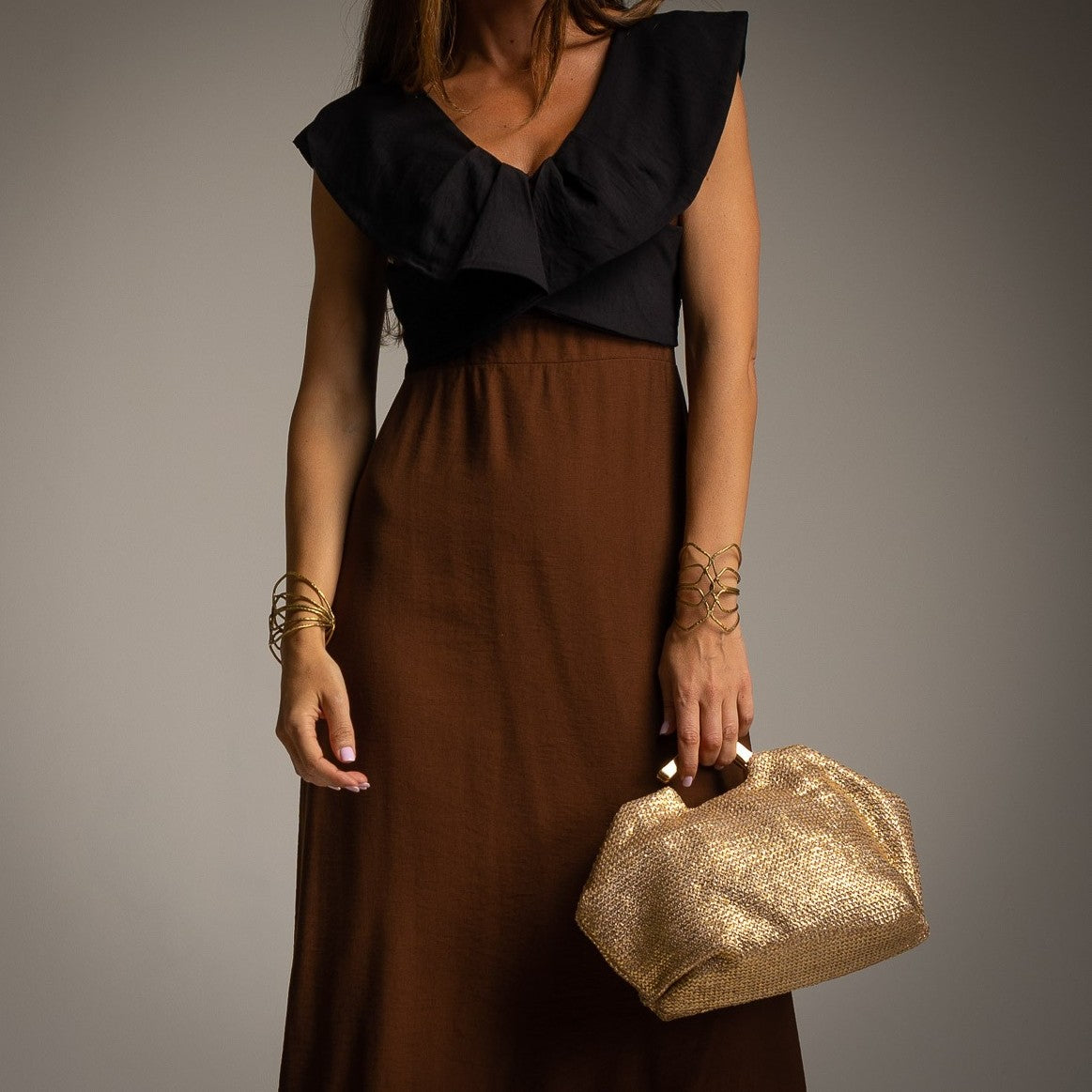 Close-up of Chocolate Mediterranean midi dress with feminine ruffle detail