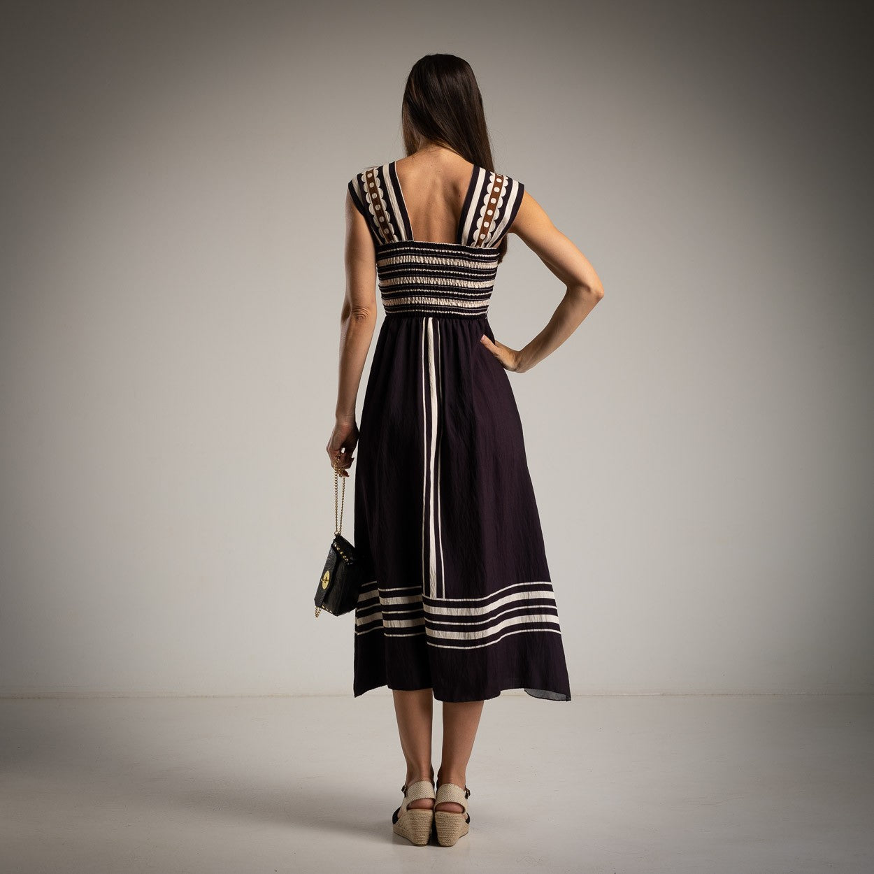 marigiou classic black cut out midi dress back view elegant silhouette