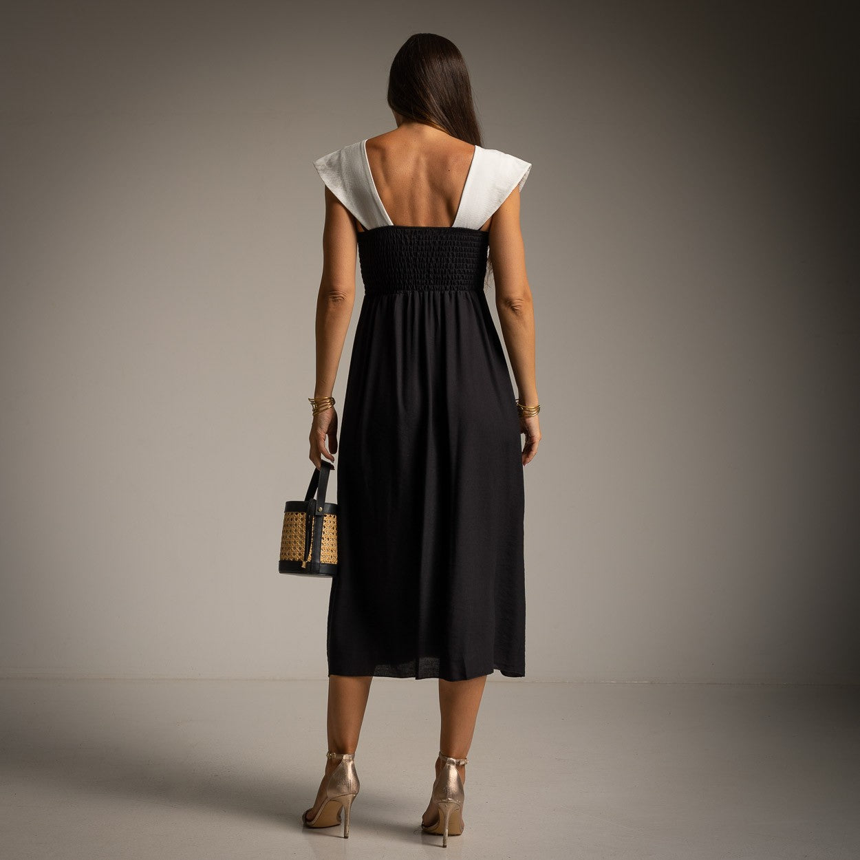 Back view of Classic Black resort midi dress with smocked back detail