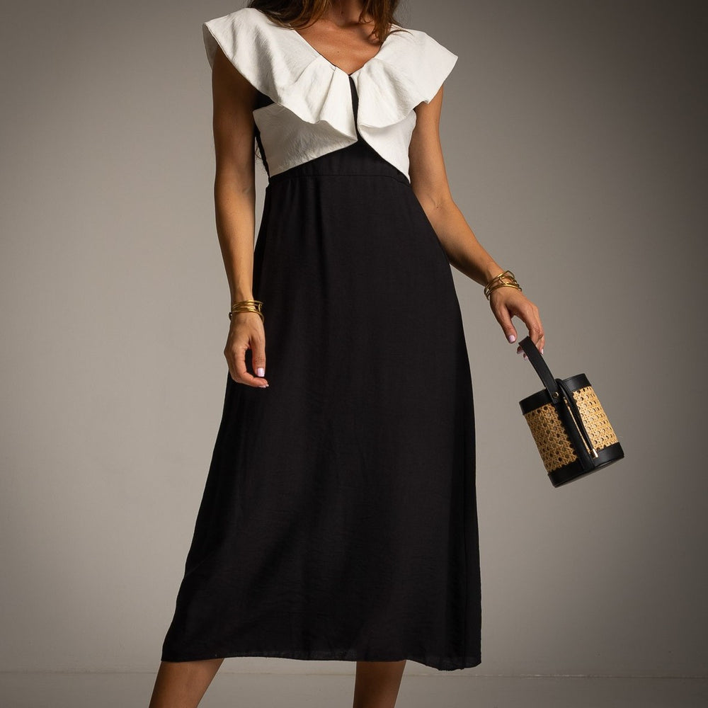 Close-up of Classic Black midi resort dress with oversized ruffle neckline