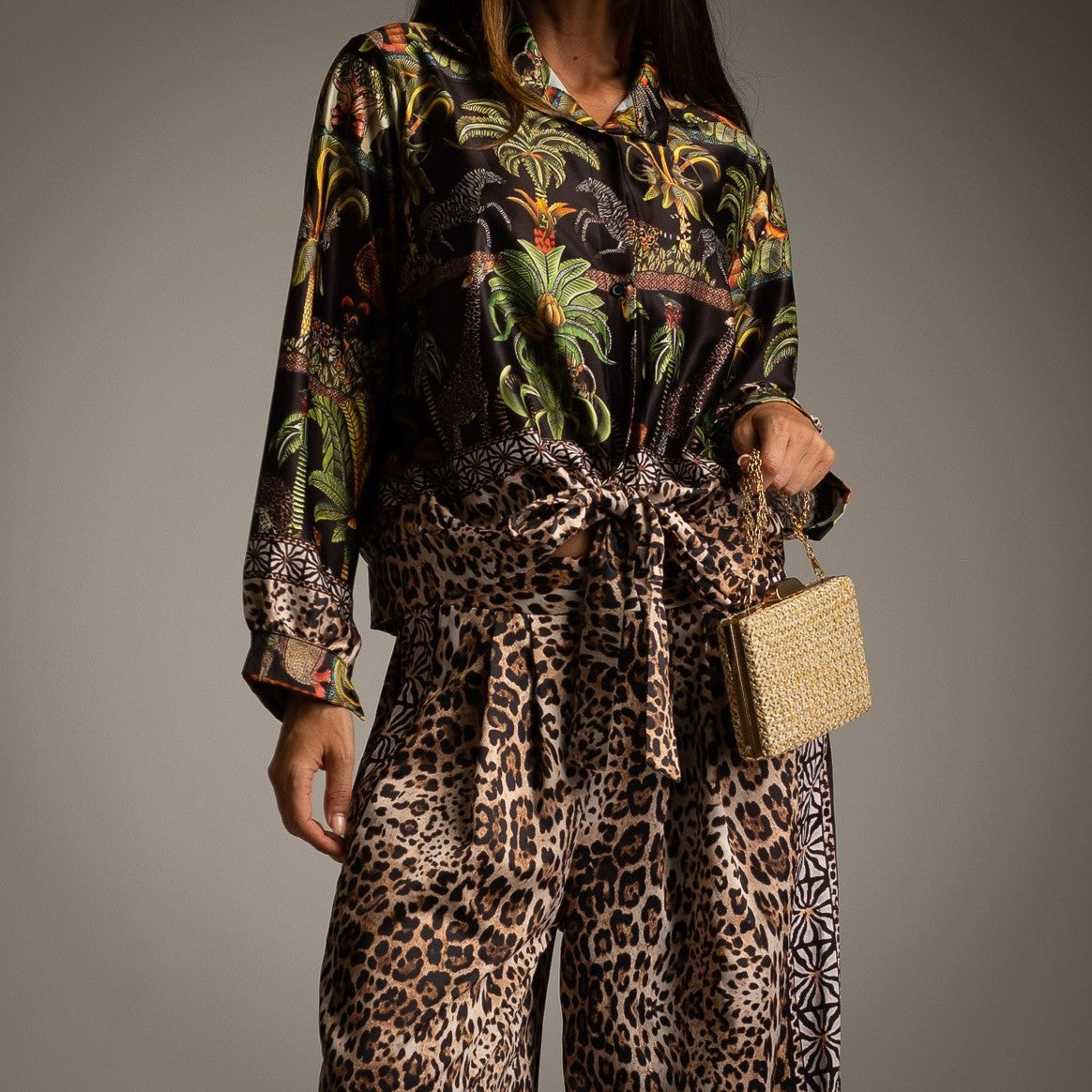 Classic black safari print shirt with tropical animal artwork styled with leopard print wide-leg trousers