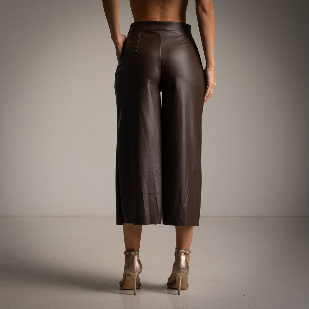 Back view of Cocoa Brown faux leather wide-leg culottes with a high-waisted fit.