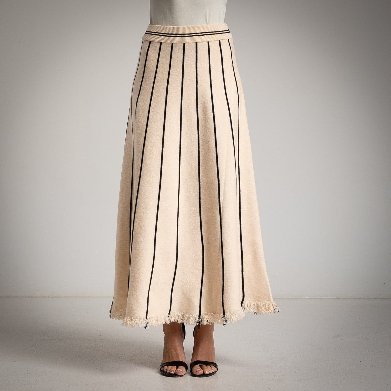 MARIΓIOÚ creme striped knit maxi skirt – front studio view