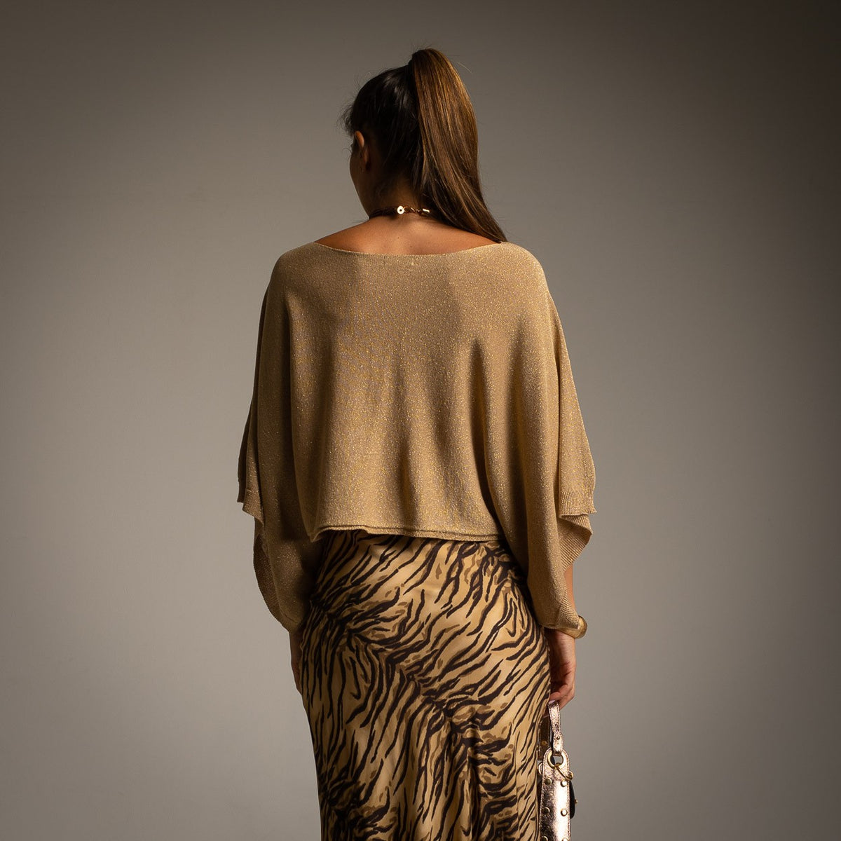 Golden Amber cropped lurex cape with wide draped sleeves - back view