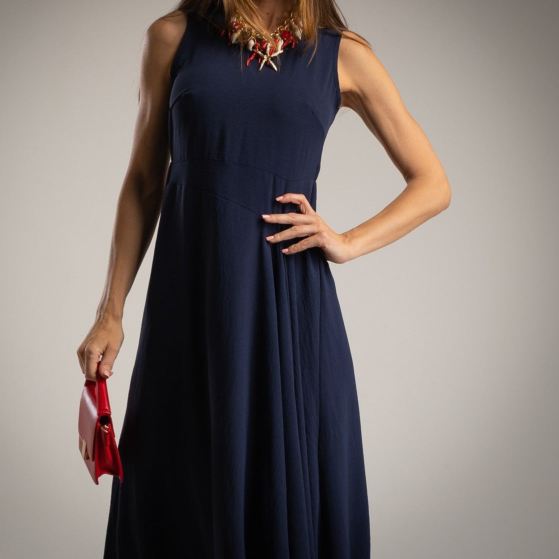 Deep Ocean Blue sleeveless midi dress with asymmetrical waist seam and elegant flowing silhouette