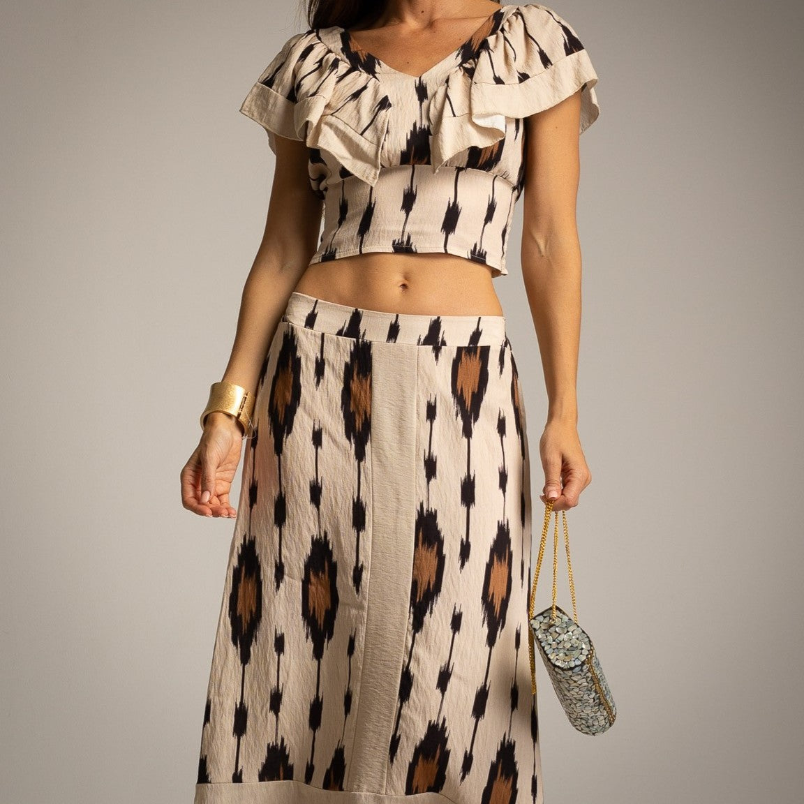 MARIΓIOÚ desert sand ikat print resort set with ruffle top and flowing maxi skirt front view