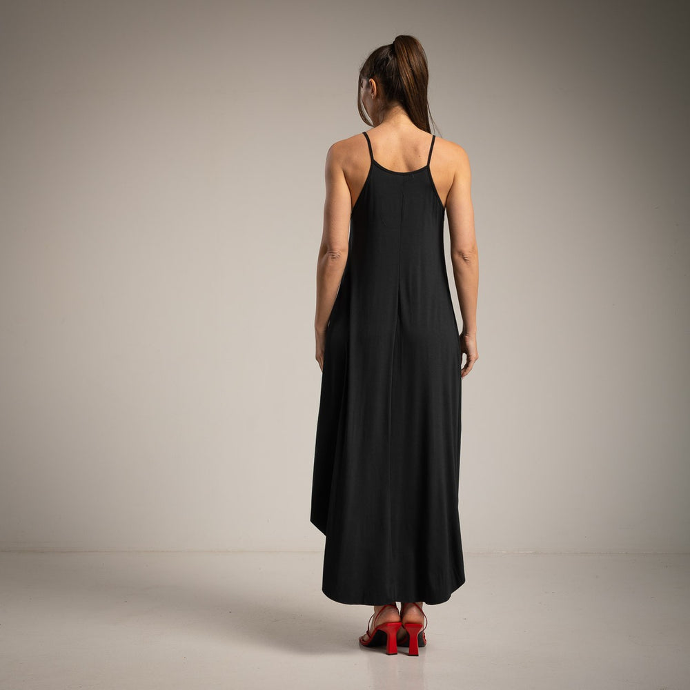 Elegant black midi dress back view with thin straps and relaxed fit