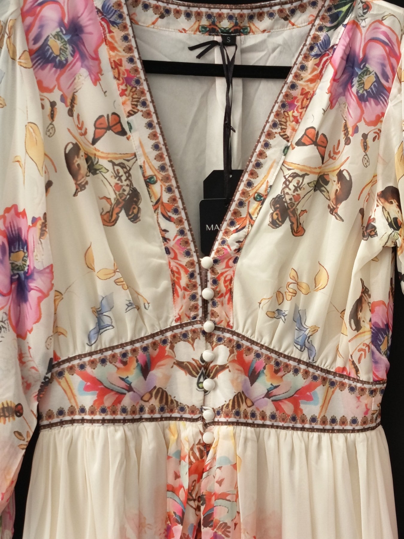 Romantic floral boho maxi dress in soft ivory detail view