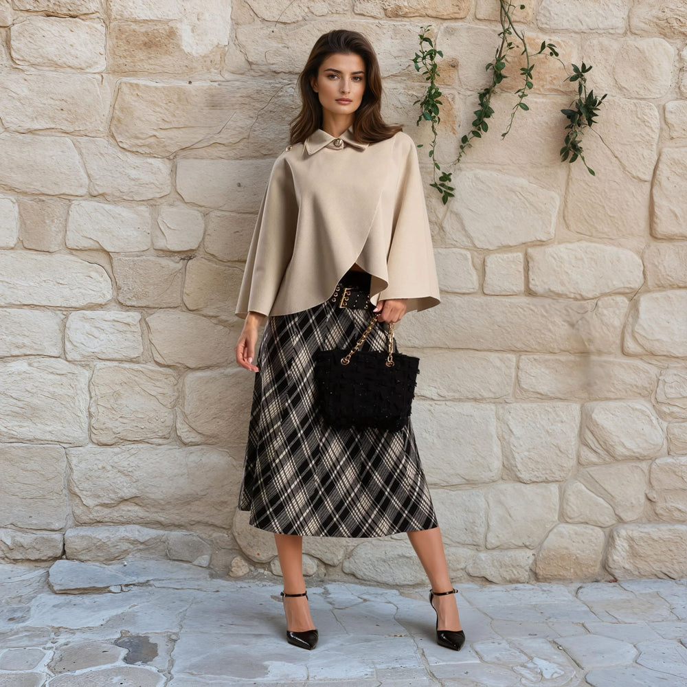 Chic street style outfit with MARIΓIOÚ light beige cape and midi skirt