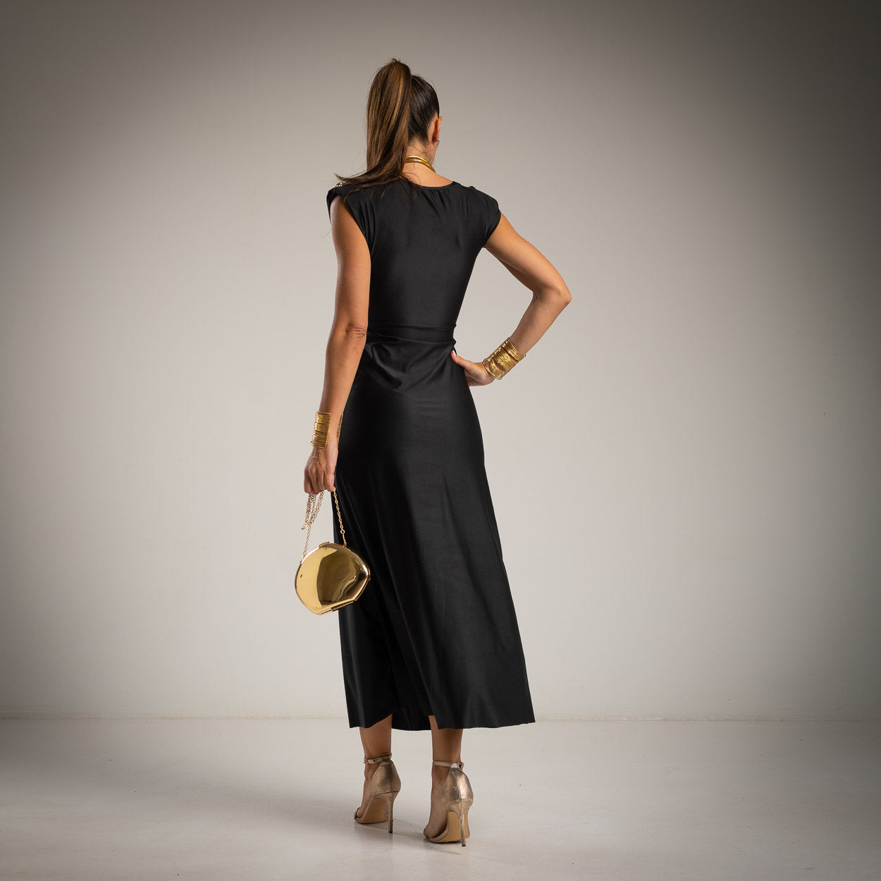 Back view of black elegant midi dress with defined waist