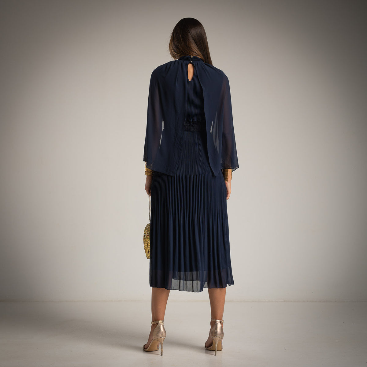Midnight Blue pleated midi dress with chiffon cape and high neckline - back view