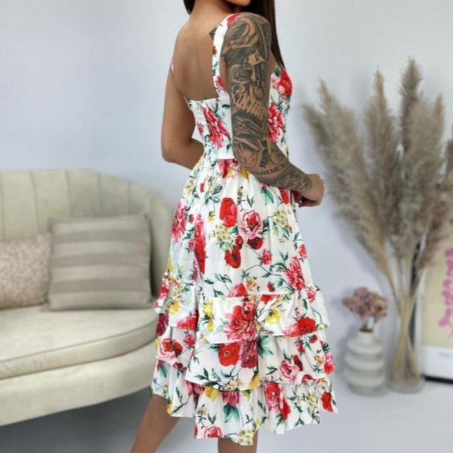 Floral midi dress in ivory white back view showing open back and flowy silhouette