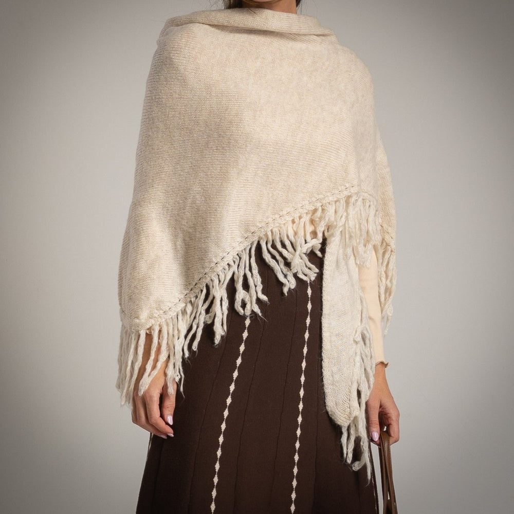 Creme knit shawl with fringe detail – front view