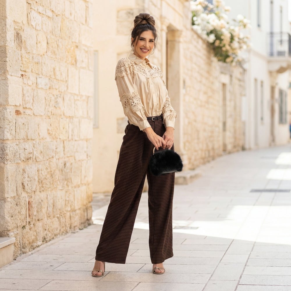 Guipure lace blouse with crochet details fully styled with pants and furry clutch