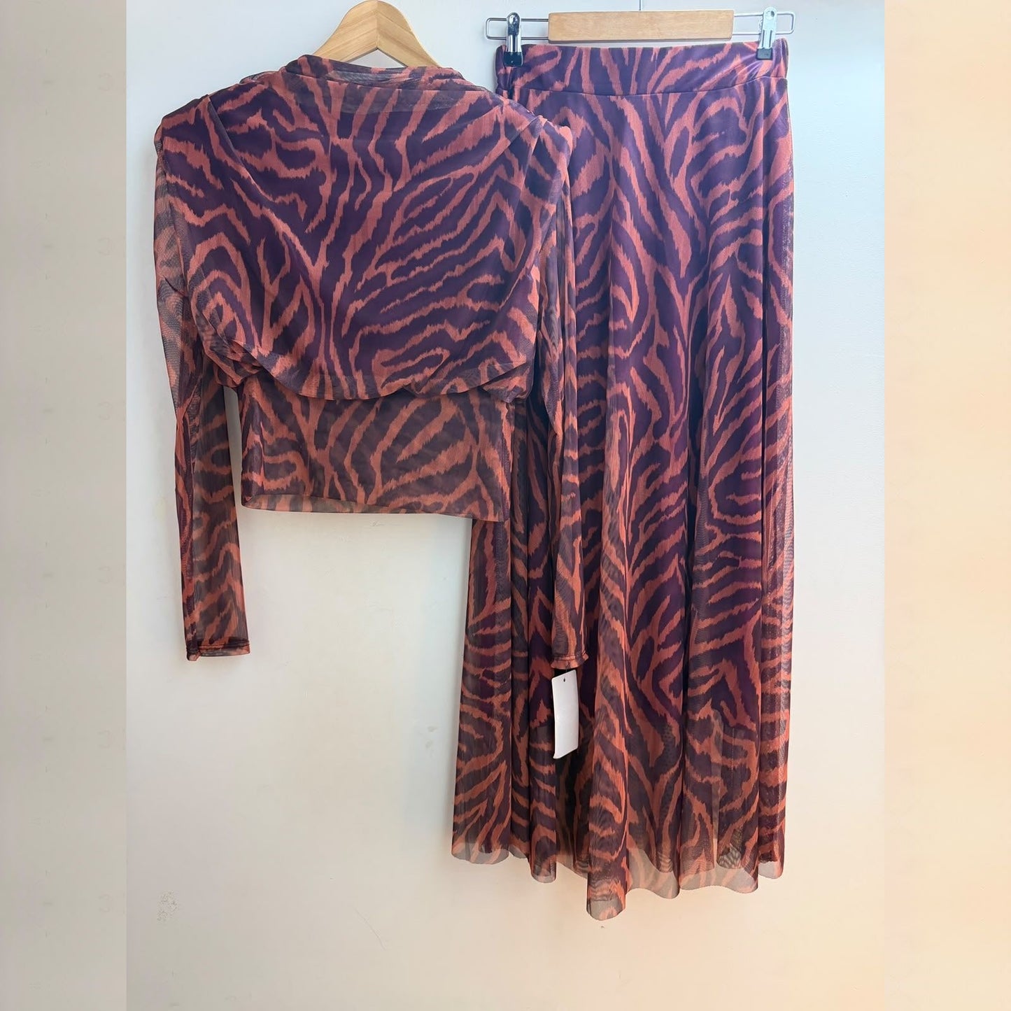 Plum animal print tulle two-piece set with cropped long-sleeve top and flowing skirt - front view