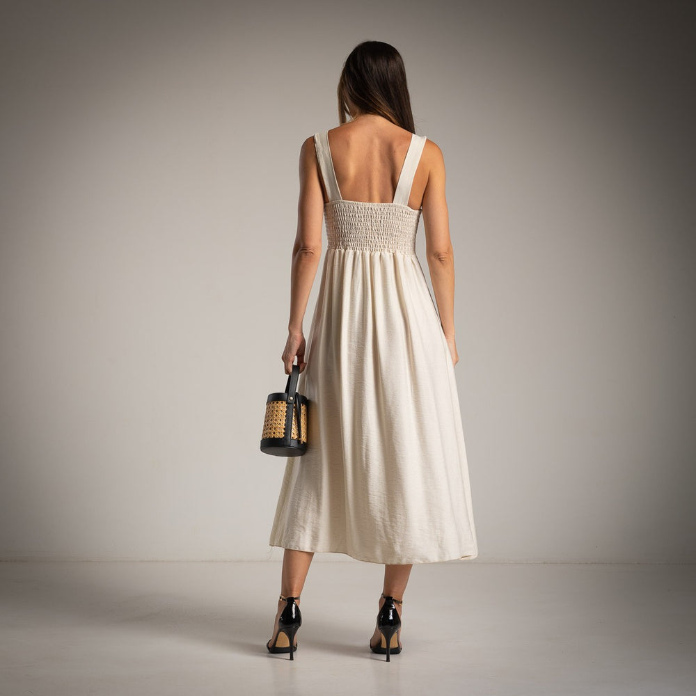 Ivory White midi dress back view with smocked back panel and elegant flowing skirt