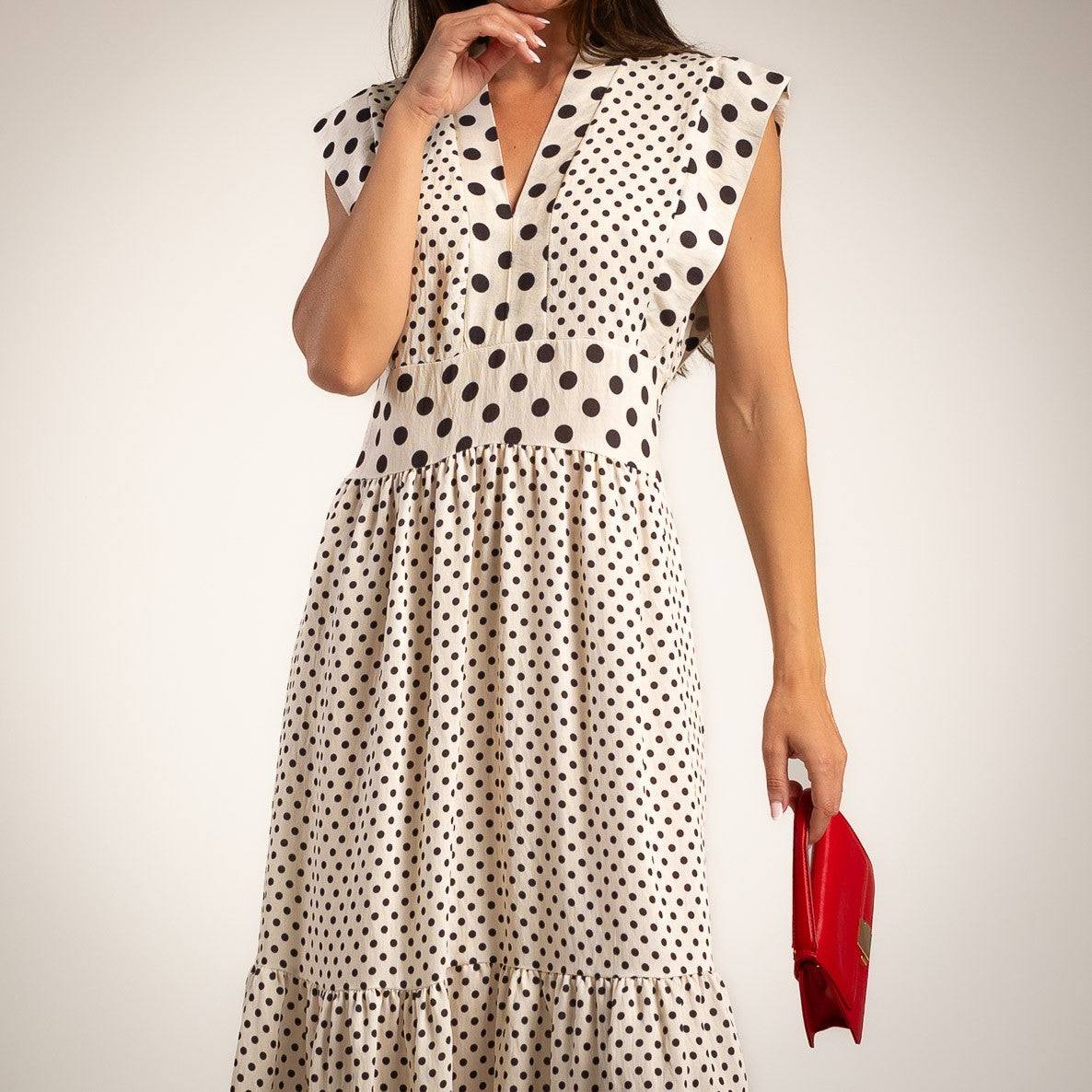 Ivory white polka dots midi dress featuring V-neckline cap sleeves and flowing midi silhouette