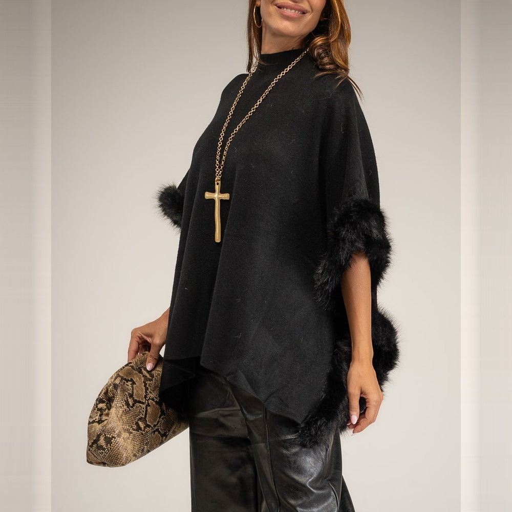 Black knit poncho with faux fur trim and mock neck - front view