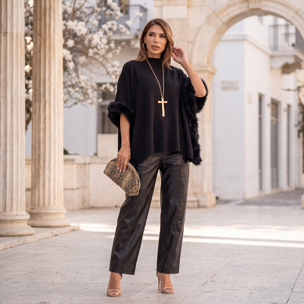 Black knit poncho with faux fur trim and mock neck by MARIΓIOU