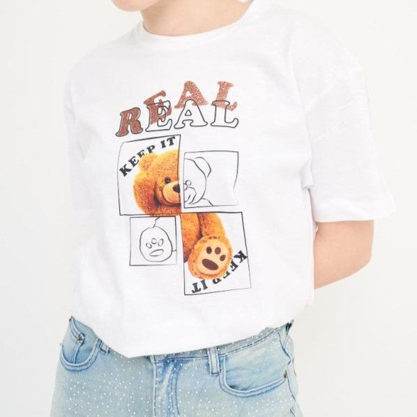 Close-up of Keep It Real graphic print on white cotton T-shirt