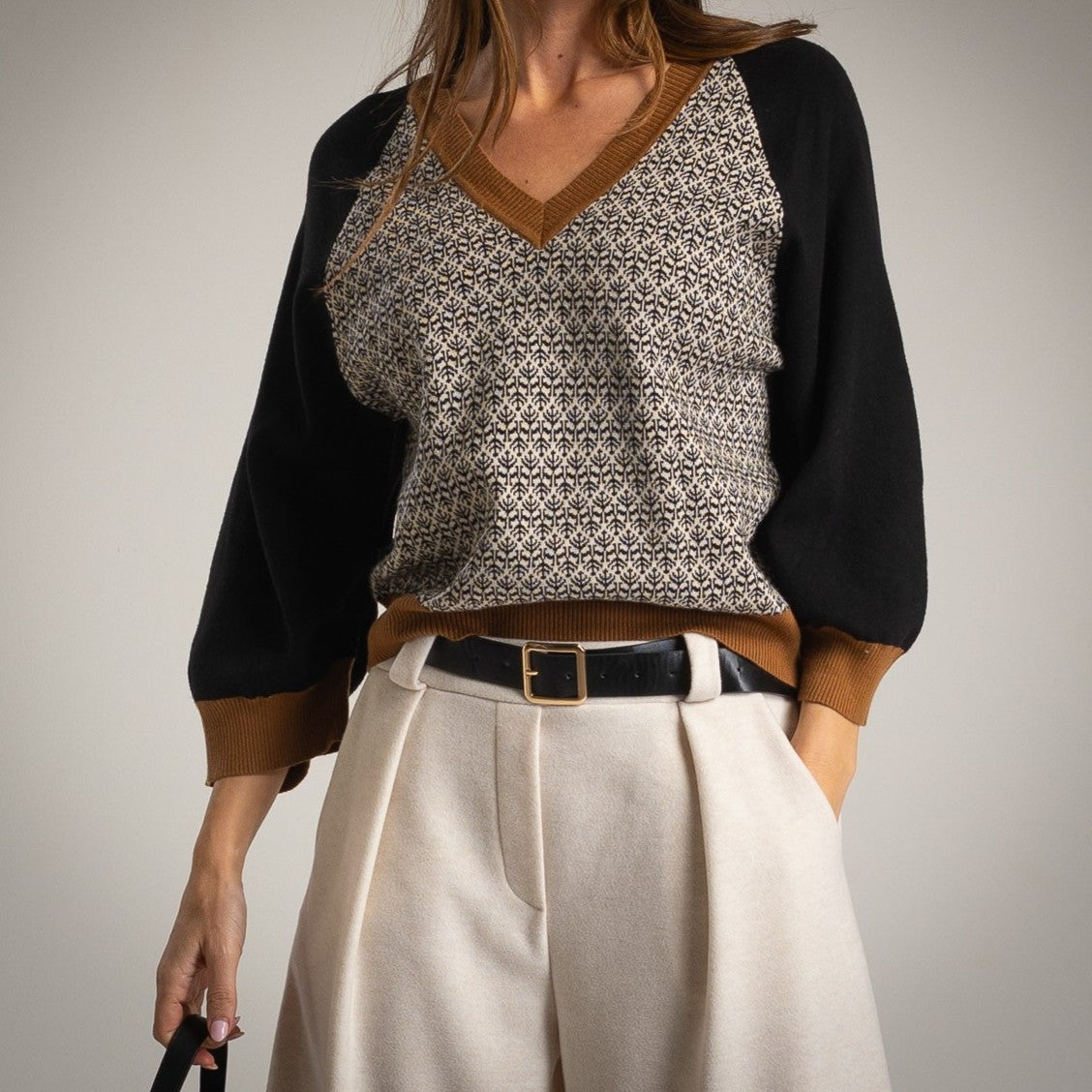 Black retro jacquard V-neck sweater with caramel contrast trims - front view