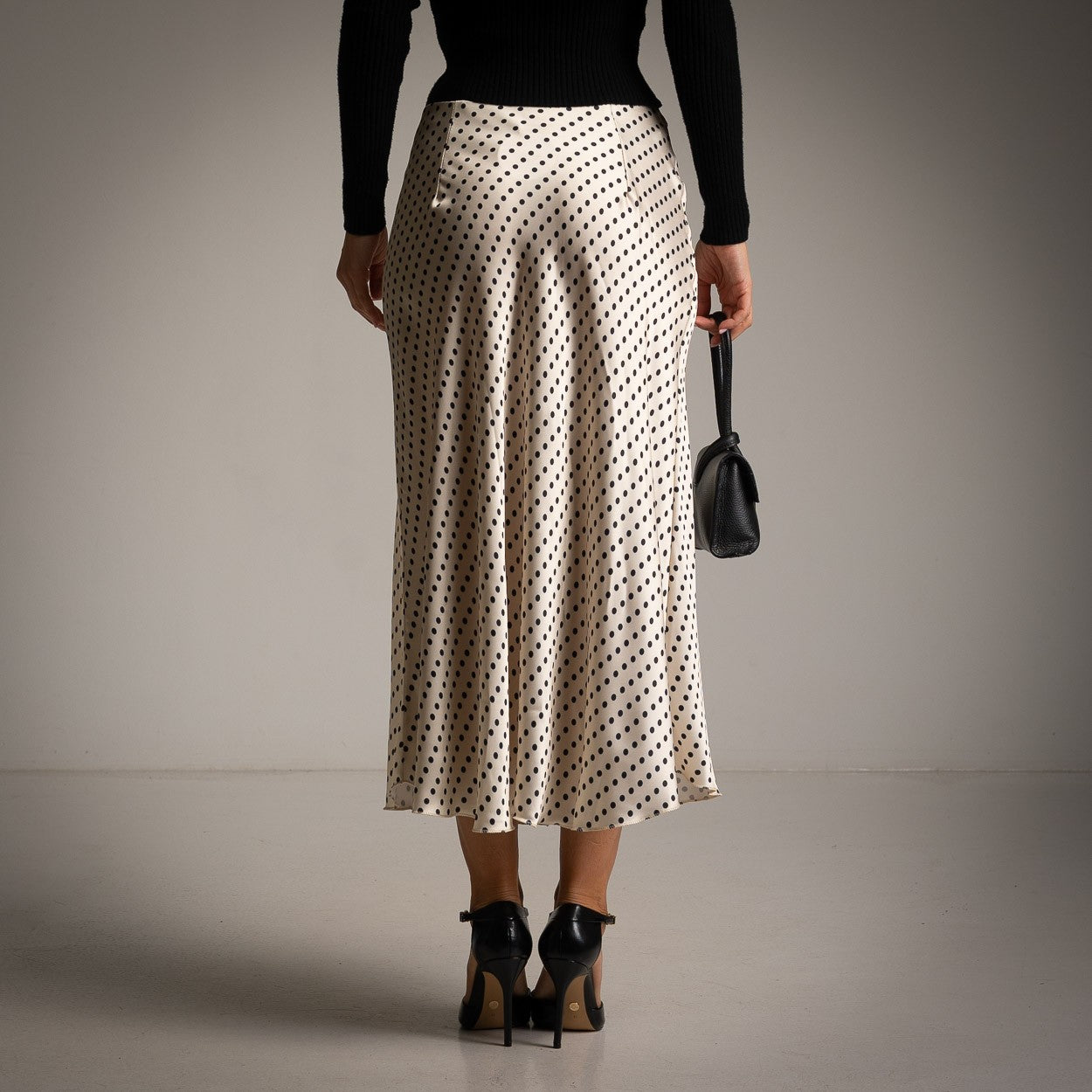 Ivory White polka dot satin midi skirt with a softly flared cut - back view