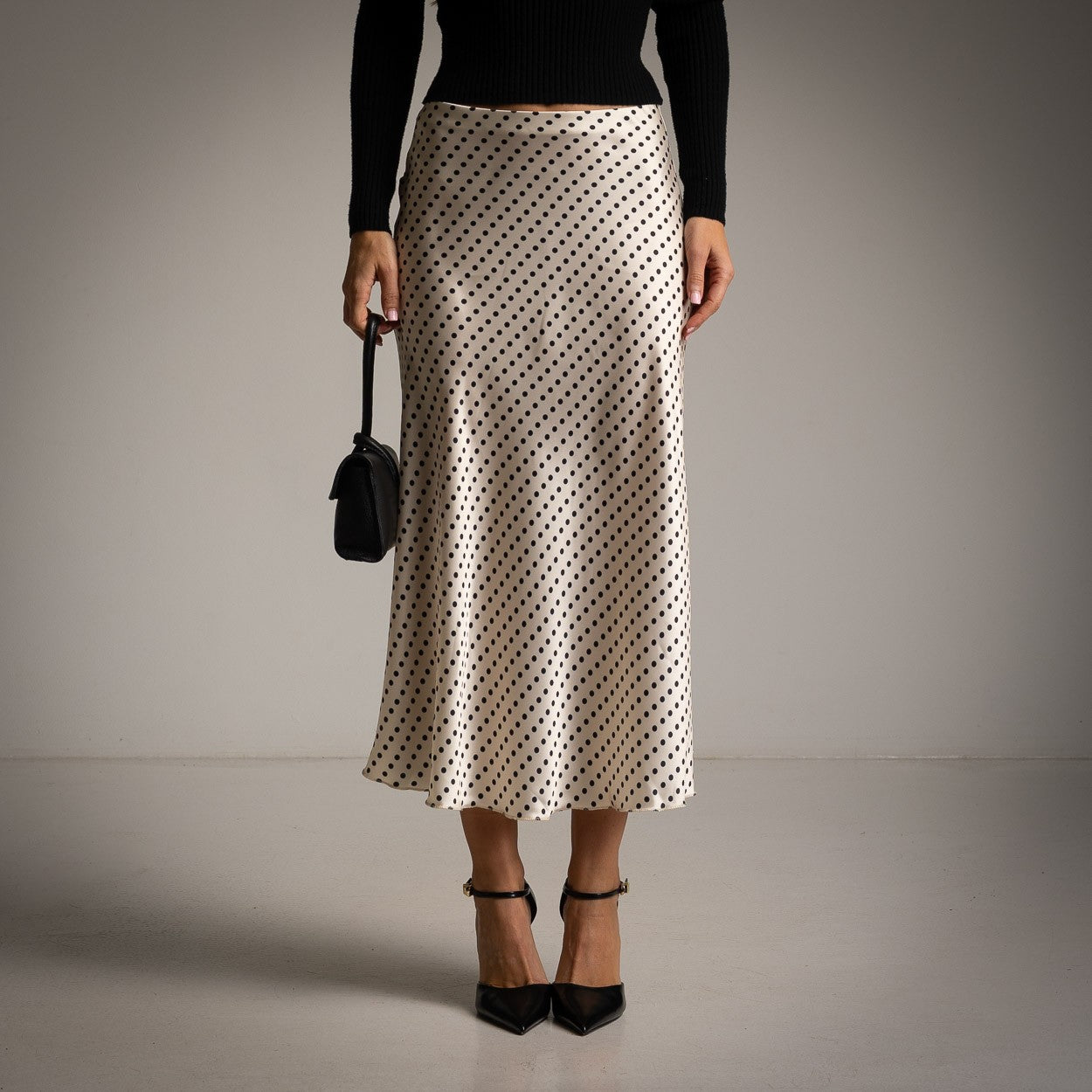 Ivory White polka dot satin midi skirt with a softly flared cut - front view